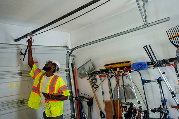 Professional Garage Door Panel Replacement technician working in Auburn, NY